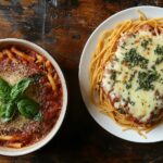 A bowl of spaghetti with marinara sauce next to beefaroni with chees