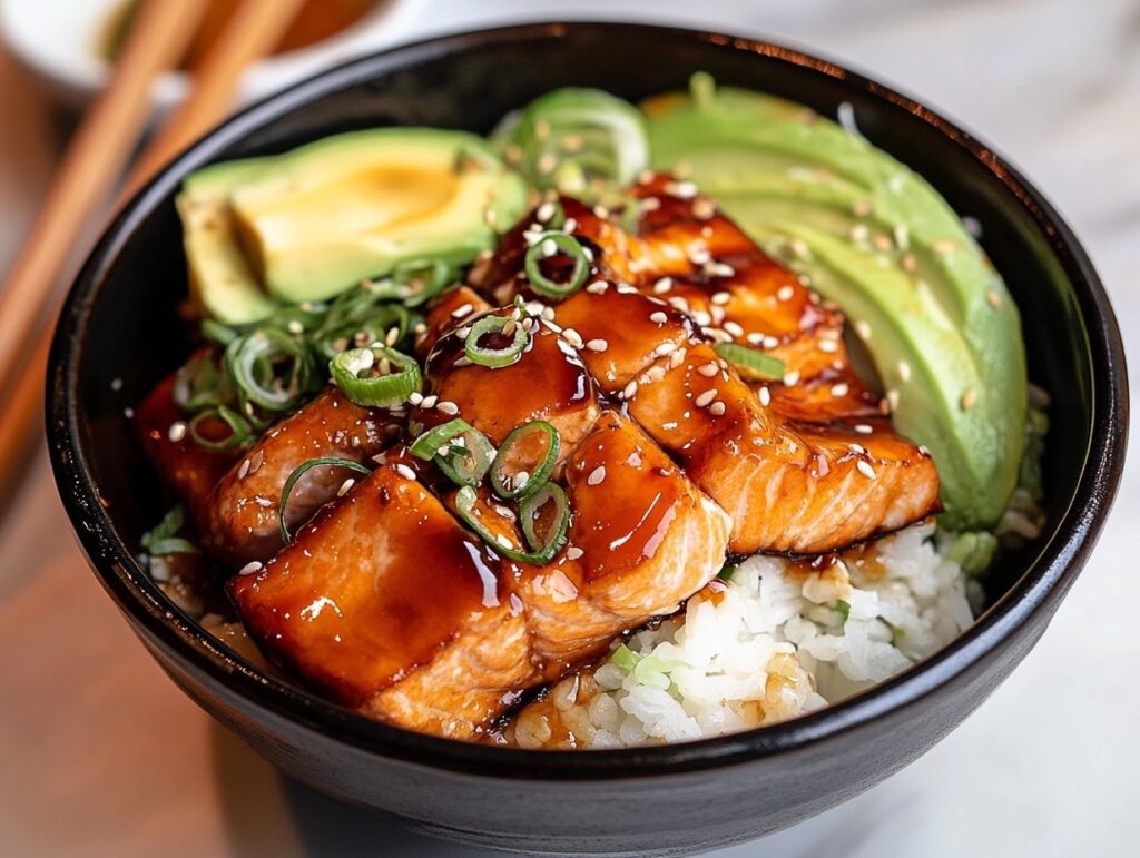 A close-up of a traditional salmon bowl with teriyaki sauce